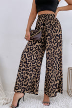 Leopard high waist wide leg pants in flowing lightweight fabric with bold tan and black leopard print pattern
