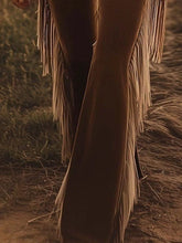 Tan leather flare pants with long dangling fringe trim showcasing stylish fringe trim flare pants design