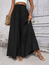 Black frill wide leg pants with high-waisted drawstring waistband and wide leg silhouette for comfortable wear