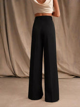 Black high-waisted wide-leg pants with a sleek tailored fit in a smooth fabric for a sophisticated look