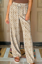 Cream-colored leopard print loose pants with wide legs and leopard drawstring elastic waistband for comfort