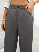 Gray high waist wide leg trousers with a sleek straight-leg cut and button closure at the waist