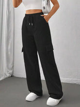 Black relaxed fit pants with drawstring waist and side pockets designed for comfort and casual wear