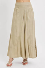 Beige risen shirring detail wide leg pants with high waist pleated front and subtle ruffled hem detailing