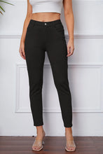 Black high-waisted slim-fit stretchyStitch pants by Basic Bae with button closure and subtle stitching for a perfect fit