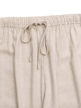 Beige linen drawstring wide leg pants with a comfortable elastic waistband for casual wear