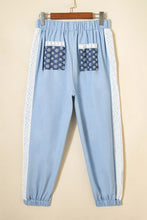 Light blue cotton wide leg joggers with lace accent floral white lace trim and navy floral patched pockets