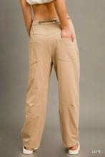 Beige wide-leg cargo-inspired drawstring pants back view with two pockets and metallic belt loop detail by umgee