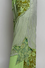 Wide-leg pants in green patchwork with floral and striped patterns featuring frayed edges and a big star patch