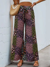 Floral high rise wide leg pants with pink green and black patchwork floral pattern and small blossoms