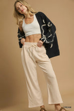 Cream-colored soft cotton umgee drawstring wide leg pants with elastic waistband for comfortable wear