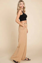 Beige culture code wide-leg cargo pants with high waist, front button closure, and side pockets for versatile wear