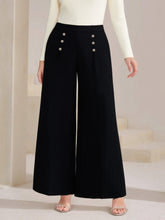 Plus size high waist wide leg black trousers featuring silver button decor on the sides for a stylish look