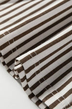 Brown and white striped fabric with neat stitching on the fold of stripe elastic high waist loose pants