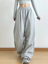 Gray loose-fitting drawstring wide leg pants with elastic waistband made for comfort and easy care instructions