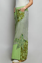 Green patchwork wide-leg pants with floral stripes partial elastic waist and big star patch detail on the side