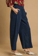 Navy blue Umgee wide-leg corduroy pants with elastic waistband and relaxed flowing silhouette