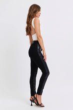 Black Judy Blue plus size high-waisted skinny pants featuring glossy faux leather side panels