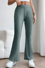 A pair of teal basic bae full size ribbed high waist flare pants made from knit fabric for stylish comfort