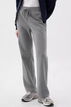 Gray drawstring loose fit pants made of soft fabric with elastic waistband for comfortable casual wear