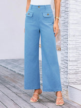 Light blue high waist wide leg pants with front pockets and gold tone buttons for a stylish look