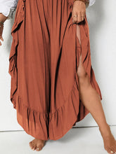 Plus size ruffled wide leg pants in rust color featuring a flowing maxi style with ruffled hem and side slit