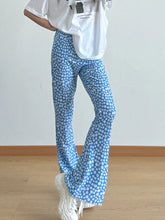 Blue floral print flare leg pants with white daisy pattern perfect for casual and spring wear