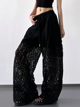 Black lace wide leg pants with a velvet upper section and drawstring waist detail for elegant wear