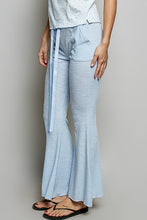 Light blue textured ribbed flare pants with matching tie belt in breathable knit fabric from pol drawstring collection