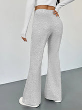 Gray heathered high waisted flare leg pants made from soft stretchy fabric with a comfortable fit