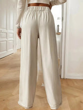 Cream-colored high-waisted wide-leg pants with satin finish and elastic waistband for plus size machine wash cold