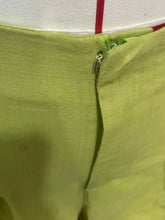 High waist wide leg flowy pants in lime green fabric with metallic zipper closure for a stylish look