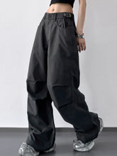 Black wide leg cargo pants with a utilitarian design featuring multiple pockets for functional wear