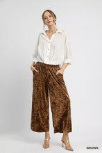 Brown velvet umgee velvet smocked waistband wide leg pants featuring a velvet smocked waistband design