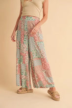 Aemi+co printed wide leg pants in pastel pink and mint green patchwork with flowing, relaxed fit wide leg pants