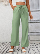 Light green casual drawstring wide leg pants with elastic waistband and drawstring for comfortable wear