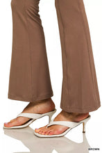 White heeled flip-flops with metallic gold heels paired with zenana brushed dty microfiber flare pants