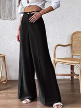 Black satin high waist wide leg pants with gold button closure offering elegant and stylish formal wear