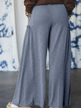 Gray casual wide leg drawstring pants with soft textured fabric and ruffled side pockets for comfortable wear