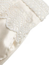 Off-white wide-leg pants with lace waist featuring delicate white lace trim on smooth satin-like fabric