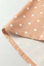 Peach-colored polka dot print drawstring wide leg pants with soft fabric and subtle ribbed inner lining texture