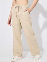 Beige linen drawstring wide leg pants with elastic waistband, relaxed fit, and side pockets for comfort and style