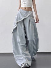 Light gray wide leg pants with delicate lace trim along side seam and single button closure in flowing fabric