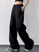Black wide leg high waist pants with sleek straight cut and subtle pleats at the waistband for a polished look