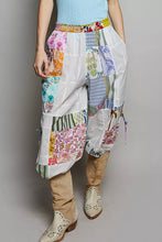 Pol printed patchwork wide leg pants featuring a vibrant mix of floral striped fabrics with a colorful elastic waistband