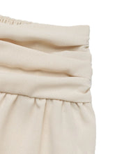 Cream-colored ruched high waist joggers waistband made of gathered fabric for a comfortable fit