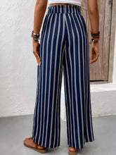 Navy blue and white striped wide leg pants with high waist designed for stylish comfort and easy care instructions