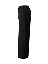Black tied wide leg pants with drawstring waistband designed as comfortable wide leg trousers for casual wear