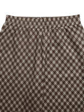 Plaid high-waisted wide leg pants with brown and white diamond pattern and elastic waistband made of soft material