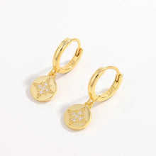 Pair of 925 sterling silver earrings with gold hoops and star zircon drops
